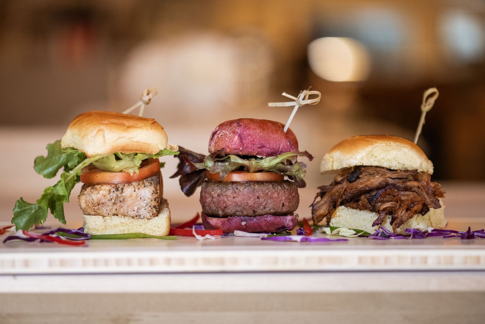Three sliders lined up on the counter at Island Grind on Main Street